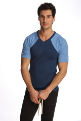 Raglan virtual crew neck t-shirt with navy blue body and light blue raglan sleeves in a comfortable v-neck design