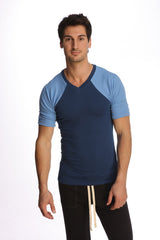 A navy blue and light blue raglan sleeve v-neck t-shirt with subtle ribbed texture called raglan virtual crew neck royal blue