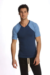 A navy blue and light blue raglan sleeve v-neck t-shirt with subtle ribbed texture called raglan virtual crew neck royal blue