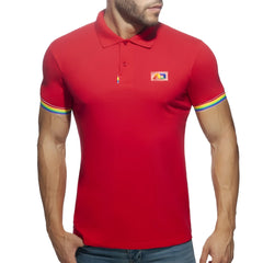 Red men’s polo shirt with rainbow trim on sleeves and a small colorful logo patch on the chest
