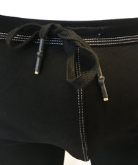 Black drawstring waistband with white stitching and metallic aglets on rainbow ribbon shorts waistband detail