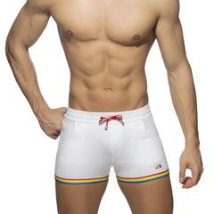 White cotton swim trunks with rainbow tape trim and red drawstring ideal for casual beachwear