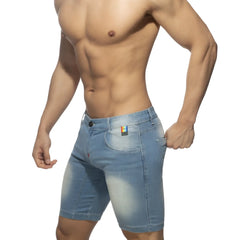 Light-wash denim rainbow tape jean short with faded distressed look and subtle thigh fading front view