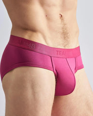 Fuchsia-colored teammb reign brief men’s snug fit briefs with elastic waistband for comfortable everyday wear