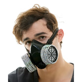 Black gas mask adorned with sparkling silver rhinestones around the filter housings for stylish protection