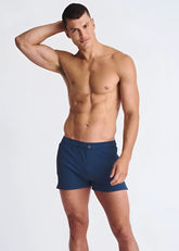 Navy blue riviera seersucker swim shorts with mesh lining and single button waistband closure for athletic use