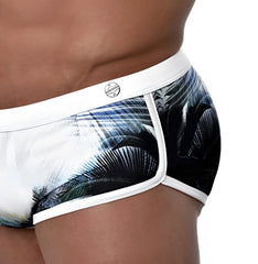 White briefs with bold black and blue palm leaf print and white trim by roberto lucca in size 2xl