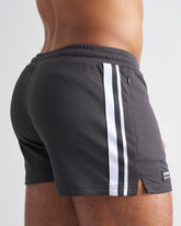 Dark gray s.s.c. fraternity 3 mesh shorts with white vertical stripes and a black brand tag on the hem