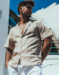 Beige Santorini linen shirt with short sleeves and embroidered detailing along the placket and hem