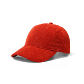 A vibrant red corduroy baseball cap with a classic six-panel design and curved brim for casual wear