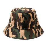 Canvas bucket hat in classic camouflage pattern with earthy greens browns and tan made from durable canvas material