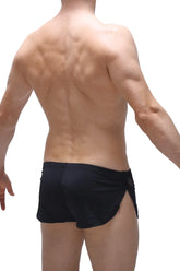 Black short lounge athletic shorts with a sleek form-fitting design and side slits for comfort and mobility
