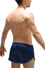Navy blue satin shorts with elastic waistband featuring a jockstrap design in a sleek satin material