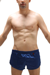 Navy blue satin swim trunks with a jockstrap and small red logo on the waistband for men