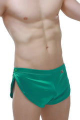 Emerald green satin swim trunks with button closure and side slits from short snap satin green collection
