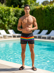 Black mesh swim trunks with a vibrant rainbow stripe across the waistband called rainbow stripe mesh shorts
