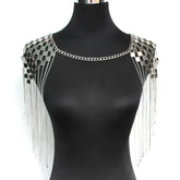 Silver metallic shoulder tassel necklace with grid of reflective square plates and dangling chain accents