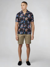 Black short-sleeved button-up shirt with vibrant blue pink and orange floral pattern signature botanical print