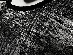 Black lace silver leaf tee with intricate textured pattern showcasing elegant sheer design
