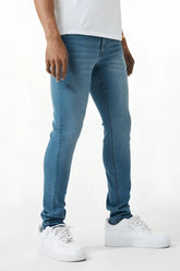 Blue slim-fit denim jeans with classic five-pocket design and subtle fading in skinny fit denim jean style