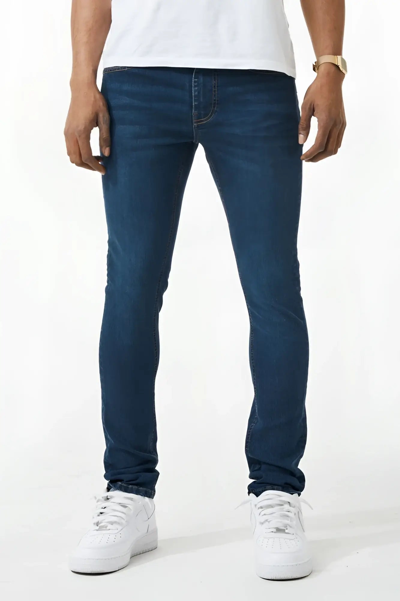 Dark blue skinny fit denim jeans with slim fit, classic five-pocket design, and subtle thigh fading
