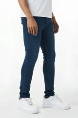 Dark blue skinny fit denim jeans with slim fit, classic five-pocket design, and subtle fading along the thighs