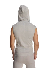 A light gray heather sleeveless yoga hoodie with a front seam and hood worn by a person