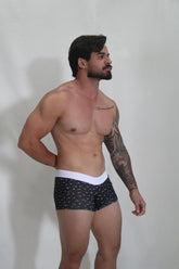 Black sperm trunk briefs with white waistband and small light-colored bird patterns for everyday comfort