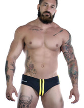 Sportivo bikini black and yellow swim trunks with bold yellow side stripes and subtle logo on the waistband