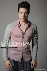 A man wearing a spy henry lau slim fit long sleeved shirt with pink and gray contrast panels in size L