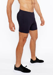 Black textured mesh stretch performance shorts with a sleek form fitting design and subtle side pockets