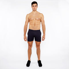 Black textured mesh stretch performance shorts with minimalist design for athletic use shown from the front