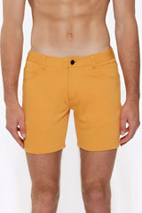 Bright yellow apricot peel st33le stretch knit shorts with black button and classic five-pocket design size 29