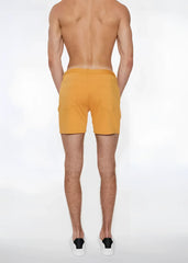 A pair of apricot peel st33le stretch knit men’s shorts with side pockets in size 29 and simple design