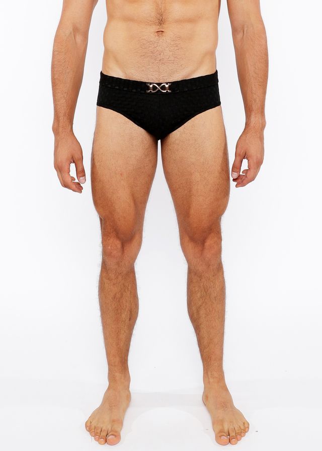 Black textured swim brief with a silver metallic interlocking double-x front buckle belt for stylish beachwear