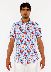 A vibrant white floral 3D print stretch knit shirt with bold red and blue blossoms and pink accents