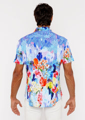 A vibrant short-sleeved woven modal shirt with bold abstract floral pattern in blue pink orange and yellow