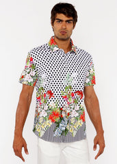A vibrant short-sleeved dots abstract s s woven modal border shirt with black polka dots and colorful floral accents