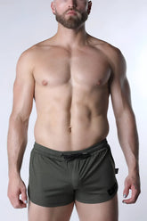 Olive green textured starter mesh shorts with black drawstring and side pocket detail for athletic wear