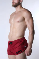 Red starter mesh shorts with black drawstring and cb13 branding on the side for athletic use