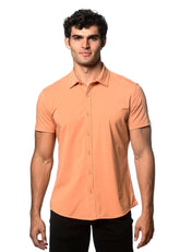 A sleek peach-colored stretch knit shirt with short sleeves button-up front and tailored fit for casual wear