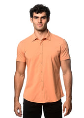 A sleek peach-colored stretch knit shirt with short sleeves button-up front and tailored fit for casual wear