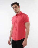 A vibrant coral stretch knit shirt with short sleeves, button-up front, classic collar, and tailored fit