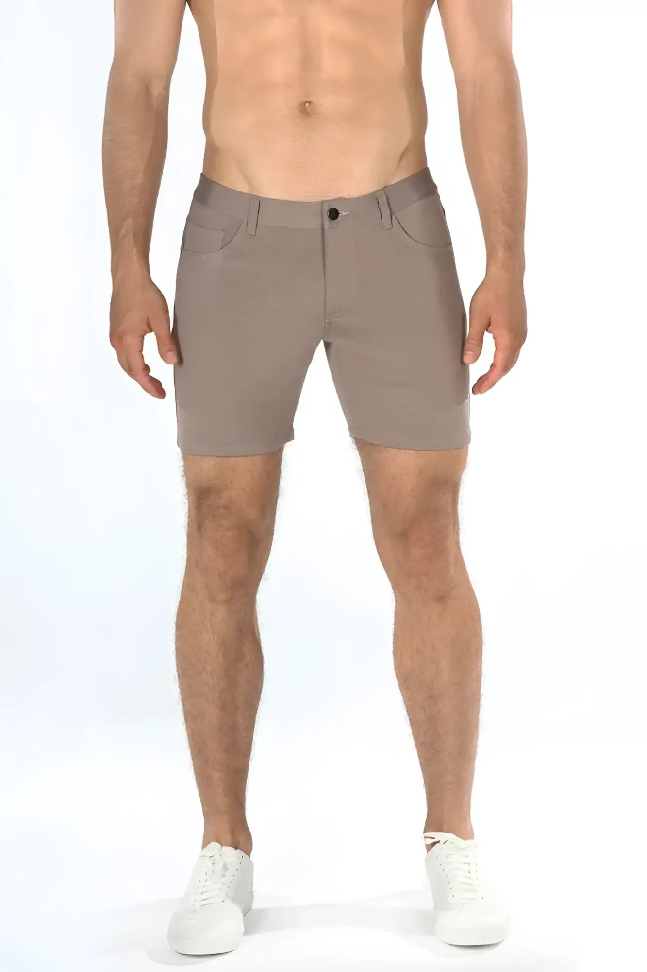 Beige stretch knit shorts with sleek modern design and subtle stitching details for comfortable wear