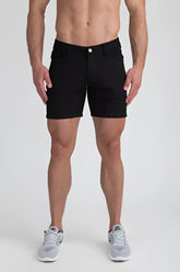 Black stretch knit shorts with classic five-pocket design and white button closure for casual wear