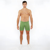 Green stretch knit shorts with a clean tailored fit and subtle stitching details for comfortable wear