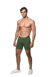 A pair of dark green stretch knit short slim-fit chino shorts with classic five-pocket design and belt loops