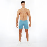 A pair of light blue stretch knit shorts with a form-fitting modern design for active wear