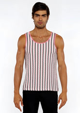 A man wearing a pink and gray striped open knit tank top with matching pink trim around the neckline