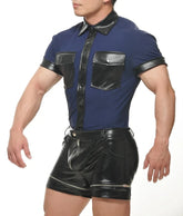 A muscular model wears a navy blue muscle top with black leather trim and pockets, paired with black leather shorts.